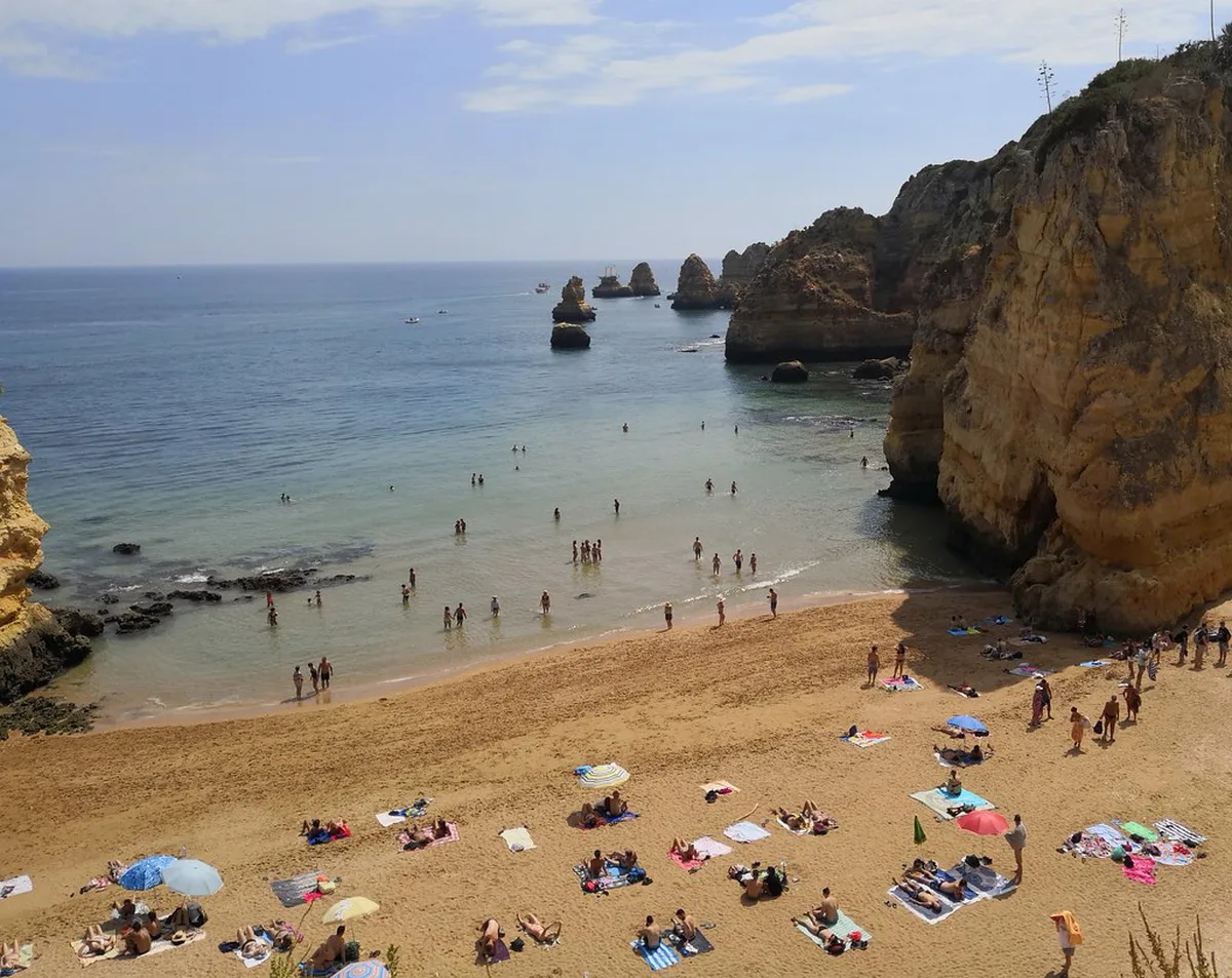 Golden cliffs and turquoise water on the western Algarve coast near Lagos
